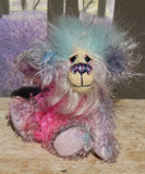 Pru is a beautiful, happy and gently colourful, one of a kind, hand dyed mohair little artist teddy bear by Barbara-Ann Bears she stands just under 5 inches/13 cm tall. Pru is made from several different mohairs that Barbara has dyed pink, lilac and blue together with a soft sky blue faux fur, velvet paw pads, hand painted eyes with eyelids, a beautifully embroidered nose and a sweet smile