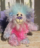 Pru is a beautiful, happy and gently colourful, one of a kind, hand dyed mohair little artist teddy bear by Barbara-Ann Bears she stands just under 5 inches/13 cm tall. Pru is made from several different mohairs that Barbara has dyed pink, lilac and blue together with a soft sky blue faux fur, velvet paw pads, hand painted eyes with eyelids, a beautifully embroidered nose and a sweet smile