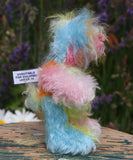 Bert is a very happy and colourful little teddy bear, a one of a kind, mohair artist bear by Barbara-Ann Bears, he stands just under 6 inches/15 cm tall.  Bert is made from many different colourful mohairs, hand painted eyes with hand coloured eyelids, a splendid nose embroidered from individual threads and he has a sweet, friendly smile.