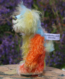 Bert is a very happy and colourful little teddy bear, a one of a kind, mohair artist bear by Barbara-Ann Bears, he stands just under 6 inches/15 cm tall.  Bert is made from many different colourful mohairs, hand painted eyes with hand coloured eyelids, a splendid nose embroidered from individual threads and he has a sweet, friendly smile.