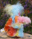 Bert is a very happy and colourful little teddy bear, a one of a kind, mohair artist bear by Barbara-Ann Bears, he stands just under 6 inches/15 cm tall.  Bert is made from many different colourful mohairs, hand painted eyes with hand coloured eyelids, a splendid nose embroidered from individual threads and he has a sweet, friendly smile.
