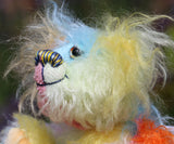 Bert is a very happy and colourful little teddy bear, a one of a kind, mohair artist bear by Barbara-Ann Bears, he stands just under 6 inches/15 cm tall.  Bert is made from many different colourful mohairs, hand painted eyes with hand coloured eyelids, a splendid nose embroidered from individual threads and he has a sweet, friendly smile.