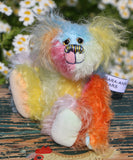Bert is a very happy and colourful little teddy bear, a one of a kind, mohair artist bear by Barbara-Ann Bears, he stands just under 6 inches/15 cm tall.  Bert is made from many different colourful mohairs, hand painted eyes with hand coloured eyelids, a splendid nose embroidered from individual threads and he has a sweet, friendly smile.