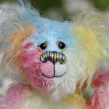 Bert is a very happy and colourful little teddy bear, a one of a kind, mohair artist bear by Barbara-Ann Bears, he stands just under 6 inches/15 cm tall.  Bert is made from many different colourful mohairs, hand painted eyes with hand coloured eyelids, a splendid nose embroidered from individual threads and he has a sweet, friendly smile.