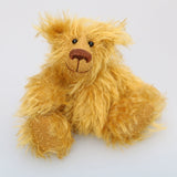 Billy McCubbin is a very sweet and happy little fluffy gold mohair artist bear by Barbara Ann Bears, he stands just 5.5 inches( 14 cm) tall and is 4.5 inches (11 cm) sitting. Billy is made from a a fluffy medium length gold mohair and his paw pads are made from the same mohair, trimmed down to the finest stubble.