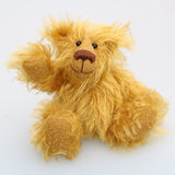 Billy McCubbin is a very sweet and happy little fluffy gold mohair artist bear by Barbara Ann Bears, he stands just 5.5 inches( 14 cm) tall and is 4.5 inches (11 cm) sitting. Billy is made from a a fluffy medium length gold mohair and his paw pads are made from the same mohair, trimmed down to the finest stubble.