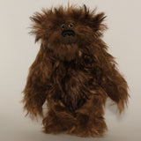 Bruno Pinehandle is a wild thing, yet a very friendly wild thing, a one of a kind, artist bear by Barbara-Ann Bears in wonderful shaggy brown mohair, he stands 12 inches/30 cm tall. He is made from a long dark brown mohair, with a longer dark brown mohair with black tipping and he has dark brown wool felt paw pads. He has beautiful hand painted glass eyes with hand coloured eyelids, a splendid nose embroidered in black cotton and a broad and cheerful smile