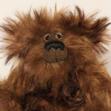 Bruno Pinehandle is a wild thing, yet a very friendly wild thing, a one of a kind, artist bear by Barbara-Ann Bears in wonderful shaggy brown mohair, he stands 12 inches/30 cm tall. He is made from a long dark brown mohair, with a longer dark brown mohair with black tipping and he has dark brown wool felt paw pads. He has beautiful hand painted glass eyes with hand coloured eyelids, a splendid nose embroidered in black cotton and a broad and cheerful smile