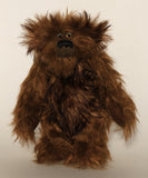 Bruno Pinehandle is a wild thing, yet a very friendly wild thing, a one of a kind, artist bear by Barbara-Ann Bears in wonderful shaggy brown mohair, he stands 12 inches/30 cm tall. He is made from a long dark brown mohair, with a longer dark brown mohair with black tipping and he has dark brown wool felt paw pads. He has beautiful hand painted glass eyes with hand coloured eyelids, a splendid nose embroidered in black cotton and a broad and cheerful smile