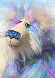 Celeste a huggable and colourful one of a kind artist bear in stunning faux fur and gorgeous fluffy mohair by Barbara-Ann Bears, she stands 18 inches/46 cm tall. Se is made from a long faux fur in blue, pink and yellow with, long fluffy white mohair, large hand painted eyes with eyelids, a splendid nose and a huge, beaming smile.