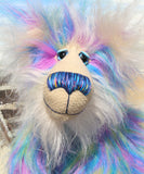 Celeste a huggable and colourful one of a kind artist bear in stunning faux fur and gorgeous fluffy mohair by Barbara-Ann Bears, she stands 18 inches/46 cm tall. Se is made from a long faux fur in blue, pink and yellow with, long fluffy white mohair, large hand painted eyes with eyelids, a splendid nose and a huge, beaming smile.