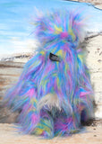 Celeste a huggable and colourful one of a kind artist bear in stunning faux fur and gorgeous fluffy mohair by Barbara-Ann Bears, she stands 18 inches/46 cm tall. Se is made from a long faux fur in blue, pink and yellow with, long fluffy white mohair, large hand painted eyes with eyelids, a splendid nose and a huge, beaming smile.