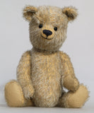 Christopher is a sweet and cuddly, traditional artist teddy bear made in splendid German mohair by Barbara Ann Bears, he stands 14 inches/ 36cm tall and is 11 inches/28cm sitting. Christopher is made from a silvery grey straight pile German mohair, with beige wool felt paw pads vintage boot buttons for eyes and a sweet smile