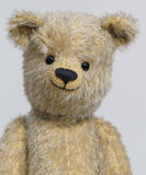 Christopher is a sweet and cuddly, traditional artist teddy bear made in splendid German mohair by Barbara Ann Bears, he stands 14 inches/ 36cm tall and is 11 inches/28cm sitting. Christopher is made from a silvery grey straight pile German mohair, with beige wool felt paw pads vintage boot buttons for eyes and a sweet smile