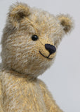 Christopher is a sweet and cuddly, traditional artist teddy bear made in splendid German mohair by Barbara Ann Bears, he stands 14 inches/ 36cm tall and is 11 inches/28cm sitting. Christopher is made from a silvery grey straight pile German mohair, with beige wool felt paw pads vintage boot buttons for eyes and a sweet smile