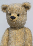 Christopher is a sweet and cuddly, traditional artist teddy bear made in splendid German mohair by Barbara Ann Bears, he stands 14 inches/ 36cm tall and is 11 inches/28cm sitting. Christopher is made from a silvery grey straight pile German mohair, with beige wool felt paw pads vintage boot buttons for eyes and a sweet smile