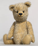 Christopher is a sweet and cuddly, traditional artist teddy bear made in splendid German mohair by Barbara Ann Bears, he stands 14 inches/ 36cm tall and is 11 inches/28cm sitting. Christopher is made from a silvery grey straight pile German mohair, with beige wool felt paw pads vintage boot buttons for eyes and a sweet smile