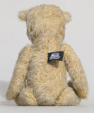 Christopher is a sweet and cuddly, traditional artist teddy bear made in splendid German mohair by Barbara Ann Bears, he stands 14 inches/ 36cm tall and is 11 inches/28cm sitting. Christopher is made from a silvery grey straight pile German mohair, with beige wool felt paw pads vintage boot buttons for eyes and a sweet smile