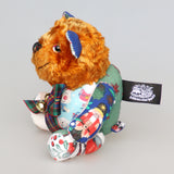 Chuffy Jingles is a very happy and friendly, one of a kind, artist teddy bear made from beautiful Christmassy fabric and vintage copper crushed velvet by Barbara Ann Bears,  he is 8 inches/20 cm tall. Chuffy Jingles is made from 10 pieces of different printed cotton Christmas fabrics and vintage, copper crushed velvet. Chuffy Jingles has beautiful hand painted eyes, a splendid carefully embroidered little nose and a very cheerful and hopeful expression