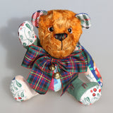 Chuffy Jingles is a very happy and friendly, one of a kind, artist teddy bear made from beautiful Christmassy fabric and vintage copper crushed velvet by Barbara Ann Bears,  he is 8 inches/20 cm tall. Chuffy Jingles is made from 10 pieces of different printed cotton Christmas fabrics and vintage, copper crushed velvet. Chuffy Jingles has beautiful hand painted eyes, a splendid carefully embroidered little nose and a very cheerful and hopeful expression