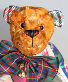 Chuffy Jingles is made from 10 pieces of different printed cotton Christmas fabrics and vintage, copper crushed velvet. Chuffy Jingles has beautiful hand painted eyes, a splendid carefully embroidered little nose and a very cheerful and hopeful expression, he comes with a nice tartan ribbon bow tie and two little bells that make this Chuffy jingle!