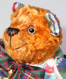 Chuffy Jingles is made from 10 pieces of different printed cotton Christmas fabrics and vintage, copper crushed velvet. Chuffy Jingles has beautiful hand painted eyes, a splendid carefully embroidered little nose and a very cheerful and hopeful expression, he comes with a nice tartan ribbon bow tie and two little bells that make this Chuffy jingle!