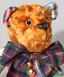 Chuffy Jingles is made from 10 pieces of different printed cotton Christmas fabrics and vintage, copper crushed velvet. Chuffy Jingles has beautiful hand painted eyes, a splendid carefully embroidered little nose and a very cheerful and hopeful expression, he comes with a nice tartan ribbon bow tie and two little bells that make this Chuffy jingle!