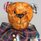 Chuffy Jingles is made from 10 pieces of different printed cotton Christmas fabrics and vintage, copper crushed velvet. Chuffy Jingles has beautiful hand painted eyes, a splendid carefully embroidered little nose and a very cheerful and hopeful expression, he comes with a nice tartan ribbon bow tie and two little bells that make this Chuffy jingle!