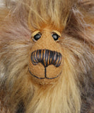 A close up of Cyrus's face, showing his beautiful golden mohair, hand painted eyes and wonderful nose. Cyrus Goldcloud is an endearingly sweet one of a kind, artist bear by Barbara-Ann Bears in wonderfully fluffy mohair and faux fur he stands 12 inches/30 cm tall