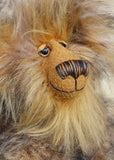 A close up of Cyrus's face viewed from the side, showing his beautiful golden mohair, hand painted eyes, wonderful nose and sweet smile. Cyrus Goldcloud is an endearingly sweet one of a kind, artist bear by Barbara-Ann Bears in wonderfully fluffy mohair and faux fur he stands 12 inches/30 cm tall