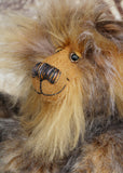 A close up of Cyrus's face viewed from the side, showing his beautiful golden mohair, hand painted eyes, wonderful nose and sweet smile. Cyrus Goldcloud is an endearingly sweet one of a kind, artist bear by Barbara-Ann Bears in wonderfully fluffy mohair and faux fur he stands 12 inches/30 cm tall