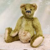 Dimpty Dimwit is sweet and happy bear, a veteran mohair artist bear from Barbara-Ann Bears, he stands 14 inches/36 cm tall. Dimpty Dimwit is made in khaki coloured straight mohair, with a beige mohair tummy and a proper belly button. He has pale beige wool felt paw pads, vintage boot button eyes and a charcoal wool nose