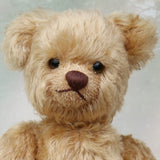 Douglas is a very sweet and friendly mohair artist teddy bear by Barbara Ann Bears, stands 11 inches/28 cm tall and is 8 inches/20 cm sitting. Douglas is a wonderful vintage traditional teddy bear we made in the early 1990s from antique gold German mohair, with felt paw pads and green glass eyes
