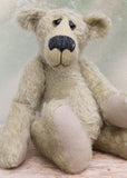 Howard is a charming and very friendly, one of a kind mohair artist bear by Barbara-Ann Bears, he stands 13.5 inches/41cm tall and is 10inches/25cm sitting. Howard is made from a medium length, sparse silvery grey mohair, with grey wool felt paw pads, hand painted glass eyes with hand coloured eyelids and a splendid nose embroidered from charcoal coloured wool