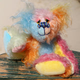 Ernie is a very happy and colourful little teddy bear, a one of a kind, mohair artist bear by Barbara-Ann Bears, he stands just under 6 inches/15 cm tall.  Ernie is made from many different colourful mohairs, hand painted eyes with hand coloured eyelids, a splendid nose embroidered from individual threads and he has a sweet, friendly smile.