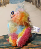 Ernie is a very happy and colourful little teddy bear, a one of a kind, mohair artist bear by Barbara-Ann Bears, he stands just under 6 inches/15 cm tall.  Ernie is made from many different colourful mohairs, hand painted eyes with hand coloured eyelids, a splendid nose embroidered from individual threads and he has a sweet, friendly smile.