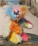 Ernie is a very happy and colourful little teddy bear, a one of a kind, mohair artist bear by Barbara-Ann Bears, he stands just under 6 inches/15 cm tall.  Ernie is made from many different colourful mohairs, hand painted eyes with hand coloured eyelids, a splendid nose embroidered from individual threads and he has a sweet, friendly smile.