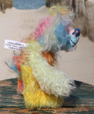 Ernie is a very happy and colourful little teddy bear, a one of a kind, mohair artist bear by Barbara-Ann Bears, he stands just under 6 inches/15 cm tall.  Ernie is made from many different colourful mohairs, hand painted eyes with hand coloured eyelids, a splendid nose embroidered from individual threads and he has a sweet, friendly smile.
