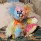 Ernie is a very happy and colourful little teddy bear, a one of a kind, mohair artist bear by Barbara-Ann Bears, he stands just under 6 inches/15 cm tall.  Ernie is made from many different colourful mohairs, hand painted eyes with hand coloured eyelids, a splendid nose embroidered from individual threads and he has a sweet, friendly smile.