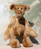 Fingal is quite a large and comical, one of a kind, artist bear by Barbara-Ann Bears in wonderful batik German mohair, he stands 20.5 inches/ 52cm tall and is 15 inches/38 cm sitting. Fingal is made from batik mohair in bands and patches of coffee and beige with greyish beige German wool felt paw pads, beautiful hand painted glass eyes with hand coloured eyelids, an impressive and wonderfully embroidered nose and an engaging smile.
