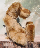 Fingal is quite a large and comical, one of a kind, artist bear by Barbara-Ann Bears in wonderful batik German mohair, he stands 20.5 inches/ 52cm tall and is 15 inches/38 cm sitting. Fingal is made from batik mohair in bands and patches of coffee and beige with greyish beige German wool felt paw pads, beautiful hand painted glass eyes with hand coloured eyelids, an impressive and wonderfully embroidered nose and an engaging smile.