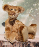 Fingal is quite a large and comical, one of a kind, artist bear by Barbara-Ann Bears in wonderful batik German mohair, he stands 20.5 inches/ 52cm tall and is 15 inches/38 cm sitting. Fingal is made from batik mohair in bands and patches of coffee and beige with greyish beige German wool felt paw pads, beautiful hand painted glass eyes with hand coloured eyelids, an impressive and wonderfully embroidered nose and an engaging smile.