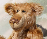 Fingal is quite a large and comical, one of a kind, artist bear by Barbara-Ann Bears in wonderful batik German mohair, he stands 20.5 inches/ 52cm tall and is 15 inches/38 cm sitting. Fingal is made from batik mohair in bands and patches of coffee and beige with greyish beige German wool felt paw pads, beautiful hand painted glass eyes with hand coloured eyelids, an impressive and wonderfully embroidered nose and an engaging smile.