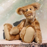 Fingal is quite a large and comical, one of a kind, artist bear by Barbara-Ann Bears in wonderful batik German mohair, he stands 20.5 inches/ 52cm tall and is 15 inches/38 cm sitting. Fingal is made from batik mohair in bands and patches of coffee and beige with greyish beige German wool felt paw pads, beautiful hand painted glass eyes with hand coloured eyelids, an impressive and wonderfully embroidered nose and an engaging smile.