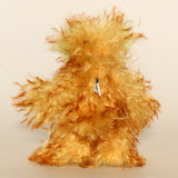 Green Eared Banana Stalker is a little, endearingly sweet and joyful, one of a kind, artist bear by Barbara-Ann Bears in wonderfully fluffy mohair, he stands 6.5 inches/17 cm tall. He is mostly made from a long golden mohair with brown tipping, with hand dyed green mohair ears, and beige wool felt paw pads. He has hand painted glass eyes with hand coloured eyelids, a wonderfully embroidered nose and a broad and cheerful smile.