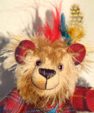 Magnus the Haggis Charmer's beautifully hand painted eyes reflect his colouring as does his carefully embroidered nose. Magnus the Haggis Charmer has two beautiful feathers sew in behind his ear and another attached to the leaf charm he has around his neck