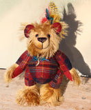Magnus the Haggis Charmer is an extremely lovable, sweet and happy one of a kind artist bear made from beautiful batik mohair and tartan fabric by Barbara Ann Bears, he stands just 8 inches (20 cm) tall. Magnus is mainly made from a stylish woollen tartan together with a shaggy coffee and beige coloured batik mohair