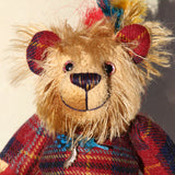 Magnus the Haggis Charmer's beautifully hand painted eyes reflect his colouring as does his carefully embroidered nose. Magnus the Haggis Charmer has two beautiful feathers sew in behind his ear and another attached to the leaf charm he has around his neck