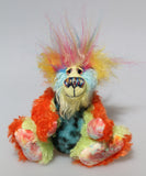 Harry Tickle is a very happy and colourful little one of a kind, hand dyed mohair and faux fur artist bear by Barbara-Ann Bears, he stands 6.5 inches/16 cm tall. Harry Tickle is made from hand dyed mohair, with long plumes of faux fur on his head, hand painted eyes, a multicoloured nose and a beaming smile a happy bear!