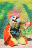 Harry Tickle is a very happy and colourful little one of a kind, hand dyed mohair and faux fur artist bear by Barbara-Ann Bears, he stands 6.5 inches/16 cm tall. Harry Tickle is made from hand dyed mohair, with long plumes of faux fur on his head, hand painted eyes, a multicoloured nose and a beaming smile a happy bear!
